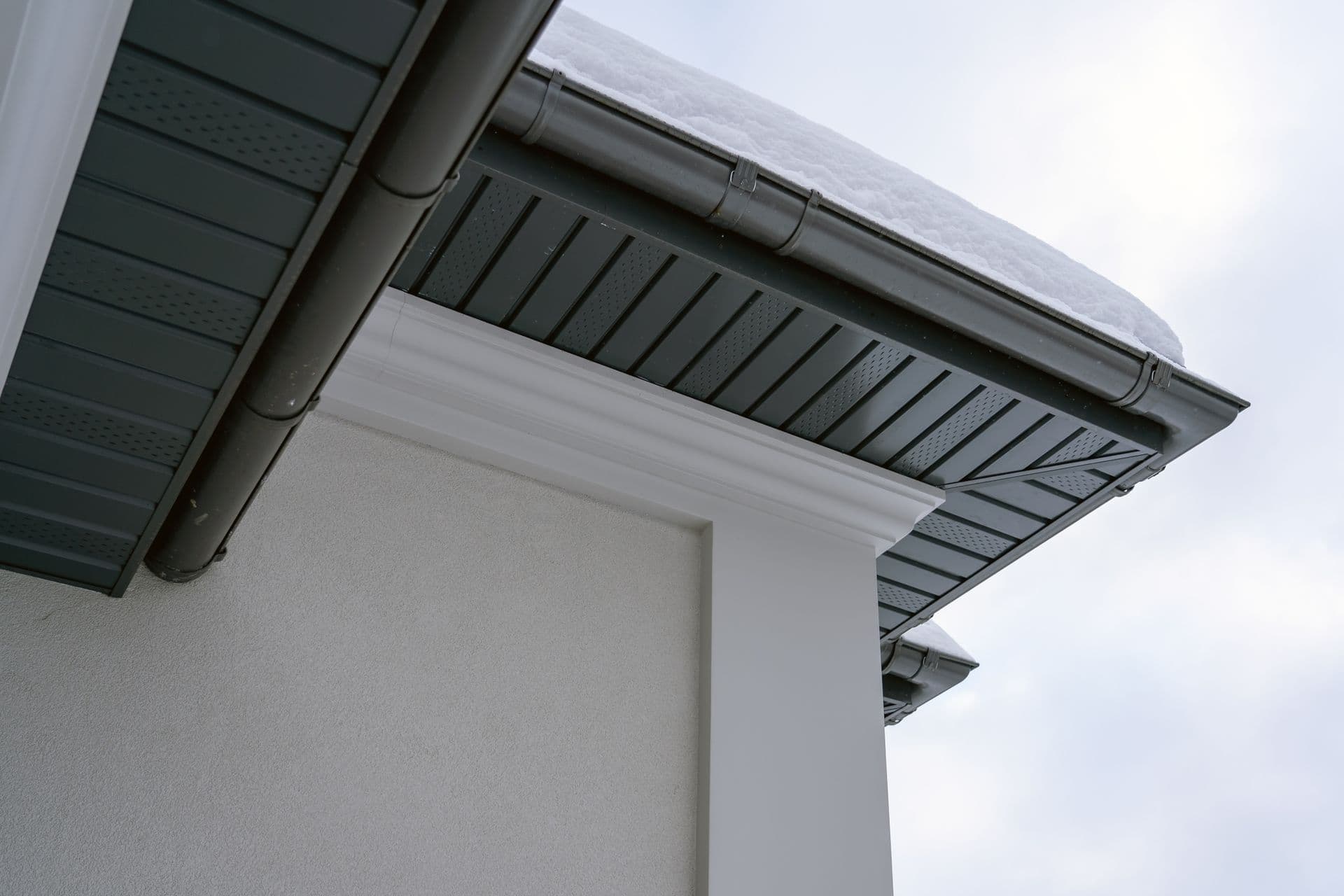 The Corner Of a House With New Gutters.